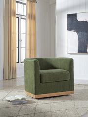Ashley Furniture Jersonlow swivel accent chair with plush fabric and modern design, shown in a cozy living room setting.
