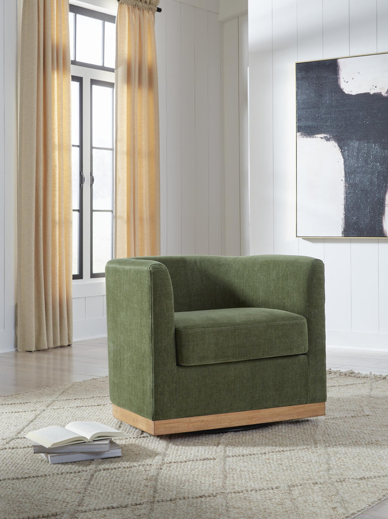 Ashley Furniture Jersonlow swivel accent chair with plush fabric and modern design, shown in a cozy living room setting.