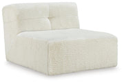 Ashley Furniture Brettner accent chair with plush upholstery and wooden legs, shown from an angled side view.