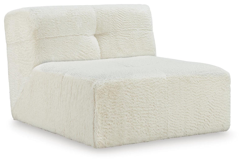 Ashley Furniture Brettner accent chair with plush upholstery and wooden legs, shown from an angled side view.