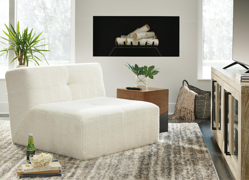 Ashley Furniture Brettner Accent Chair with plush fabric and wooden legs, shown in a cozy living room setting.