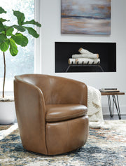 Ashley Furniture Kierreys Swivel Accent Chair with plush fabric and modern design, shown from a front angle in a stylish living room setting.