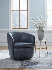 Ashley Furniture Kierreys swivel accent chair with a modern design and plush upholstery, shown in a stylish living room setting.