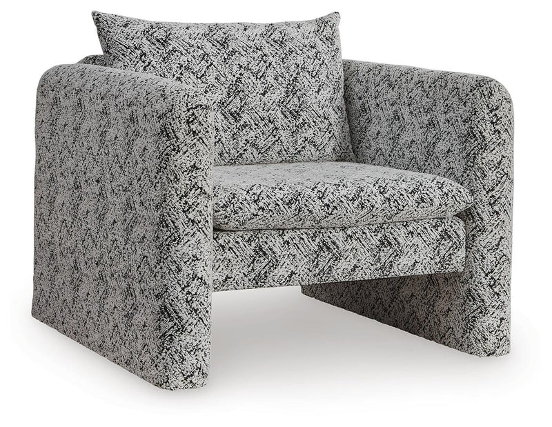 Ashley Furniture Kenbell accent chair with plush fabric and tapered wooden legs, shown from an angled side view.