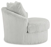 Ashley Furniture Gramwell swivel accent chair with plush upholstery and modern design, shown from a side view.