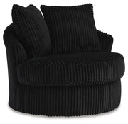 Ashley Furniture Gramwell swivel accent chair with plush upholstery and modern design, shown from an angled side view.