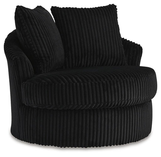 Ashley Furniture Gramwell swivel accent chair with plush upholstery and modern design, shown from an angled side view.