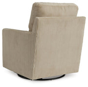 Ashley Furniture Icaman Swivel Accent Chair with upholstered fabric and wooden base, shown from the back.