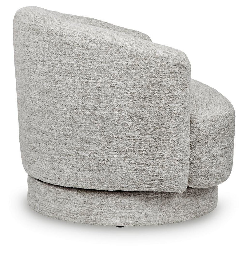 Ashley Furniture Wardsor Swivel Accent Chair with plush fabric and a modern design, shown from the side in a stylish living room setting.