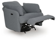 Ashley Furniture Alainmont Next-Gen Nuvella swivel power recliner accent chair with plush cushioning and modern design, shown from an angled view