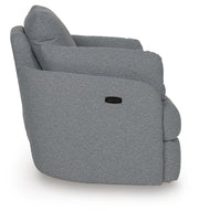 Ashley Furniture Alainmont Next-Gen Nuvella swivel accent chair with plush fabric and modern design, shown from a side view.