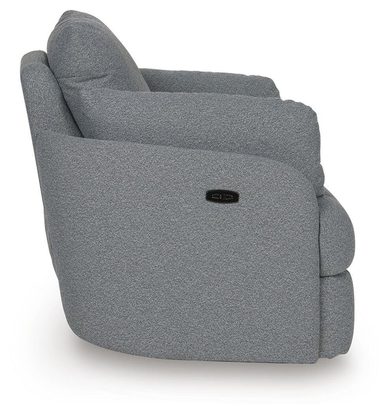 Ashley Furniture Alainmont Next-Gen Nuvella swivel accent chair with plush fabric and modern design, shown from a side view.