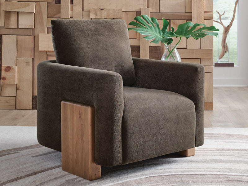 Ashley Furniture Dairlett Accent Chair with plush fabric upholstery and sleek wooden legs, stylish addition to any living room.