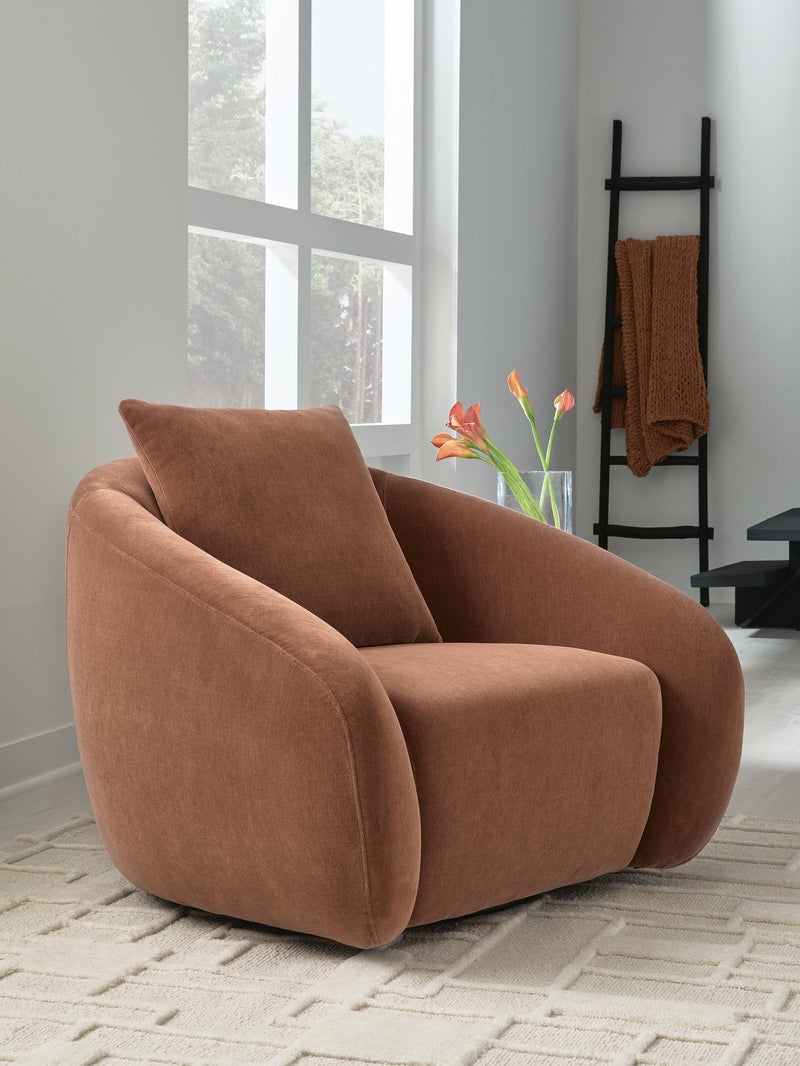 Ashley Furniture Yahya swivel accent chair with plush fabric upholstery and modern design, shown in a cozy living room setting.