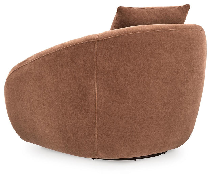 Ashley Furniture Yahya swivel accent chair with plush fabric and modern design, shown from the back in a cozy living room setting.