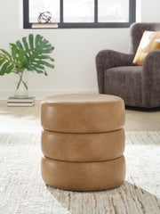 Ashley Furniture Ummi Swivel Accent Ottoman with cushioned top and wooden base, ideal for living room decor.