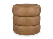 Ashley Furniture Ummi Swivel Accent Ottoman with plush fabric, round shape, and cushioned top for versatile seating or decor.