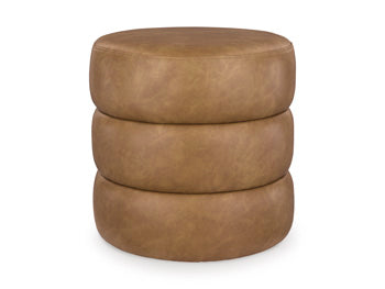 Ashley Furniture Ummi Swivel Accent Ottoman with plush fabric, round shape, and cushioned top for versatile seating or decor.