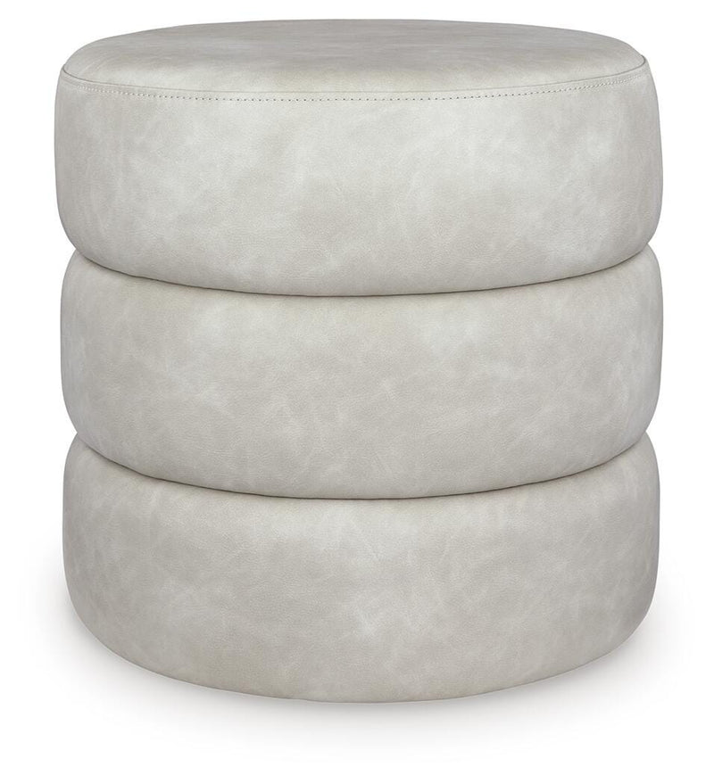 Ashley Furniture Ummi Swivel Accent Ottoman with padded fabric cushion and wooden base, perfect for living room decor.