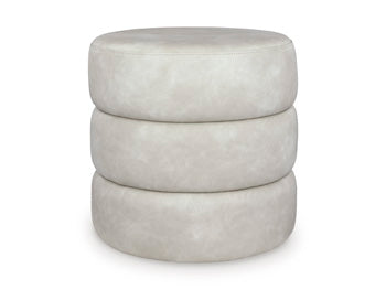 Ashley Furniture Ummi Swivel Accent Ottoman with plush fabric and a modern design, perfect for living room decor.