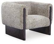 Ashley Furniture Olethea accent chair with plush fabric, angled backrest, and wooden legs, shown from an angled side view.