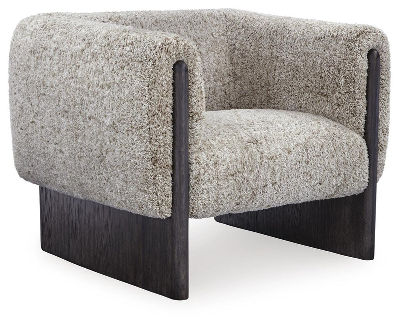 Ashley Furniture Olethea accent chair with plush fabric, angled backrest, and wooden legs, shown from an angled side view.
