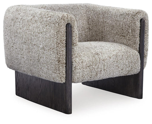 Ashley Furniture Olethea accent chair with plush fabric, angled backrest, and wooden legs, shown from an angled side view.