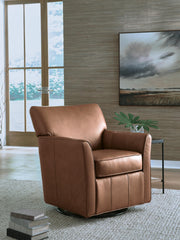 Ashley Furniture Braydunn swivel glider accent chair with plush upholstery and wooden base, shown in a cozy living room setting.