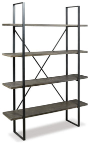 Ashley Furniture Gilesgrove Bookcase with open shelving and wood finish, shown from an angled side view.
