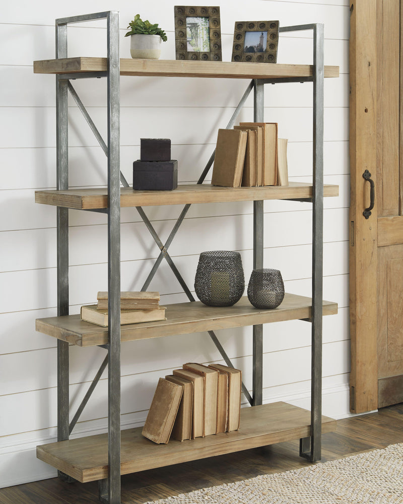 Forestmin bookcase by Ashley Furniture featuring multiple shelves and a warm wood finish, ideal for living room or office storage.