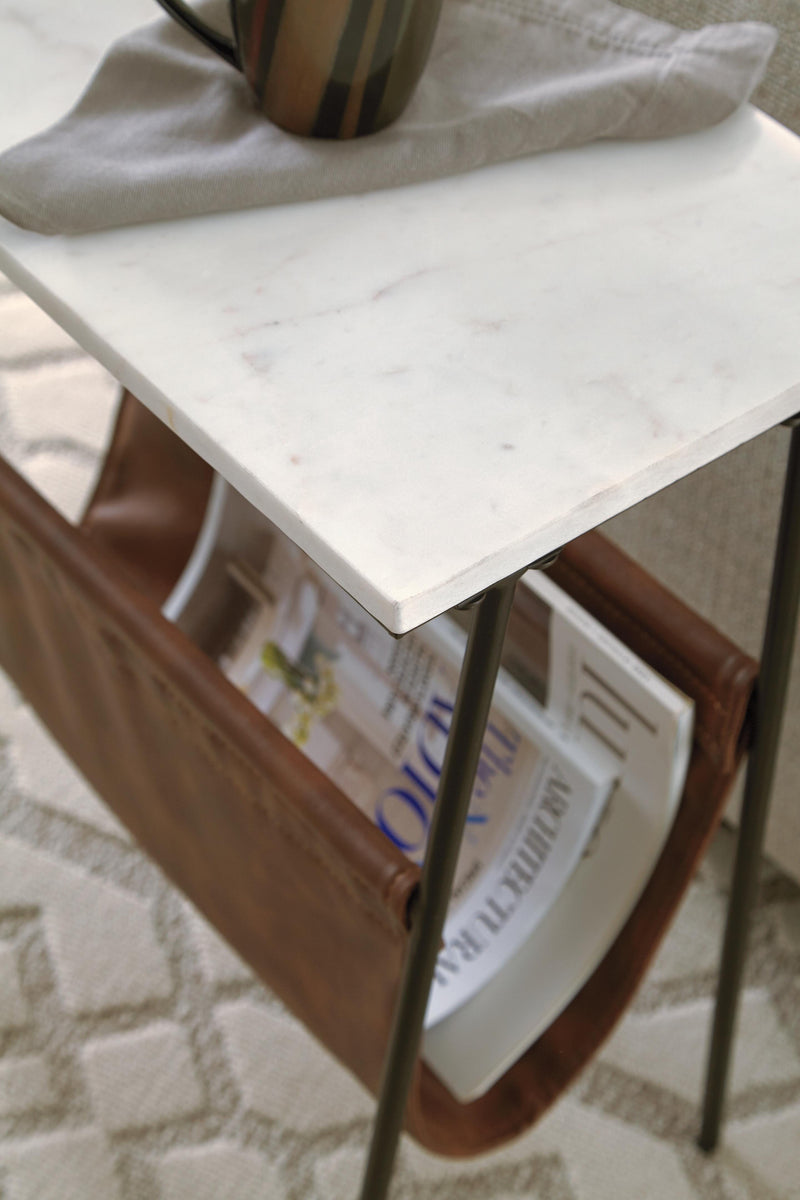 Close-up of Ashley Furniture Etanbury Accent Table with a smooth wooden top and sleek metal legs.