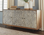 Ashley Furniture Kerrings Accent Cabinet showing wood finish, decorative hardware, and storage space in a modern living room setting.