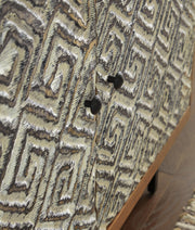 Close-up of the Kerrings Accent Cabinet by Ashley Furniture showing detailed door design and rich wood finish.
