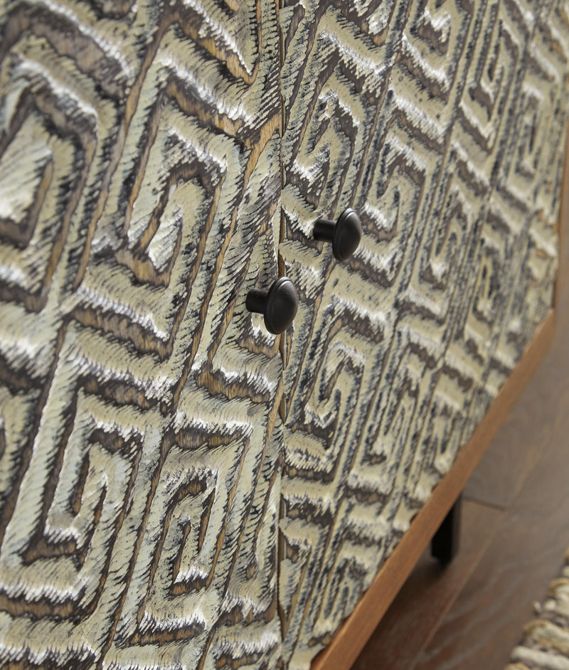 Close-up of the Kerrings Accent Cabinet by Ashley Furniture showing detailed door design and rich wood finish.