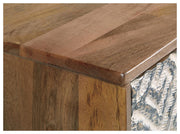 Close-up of the top detail of the Kerrings Accent Cabinet by Ashley Furniture, showcasing its stylish wood finish and elegant design.