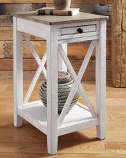 Ashley Furniture Adalane Accent Table with a sleek wooden surface and modern design, perfect for living room decor.