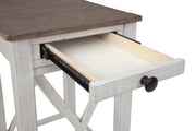 Ashley Furniture Adalane accent table with dark wood finish, round top, and sleek design, perfect for living room decor.