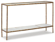 Ashley Furniture Ryandale console sofa table with a sleek wooden finish, shown from an angled view in a modern living room setting.