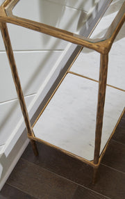 Ashley Furniture Ryandale console sofa table with a sleek wooden finish and elegant design, shown in a detailed view.