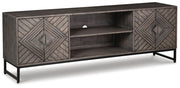 Ashley Furniture Treybrook accent cabinet with closed doors, featuring a stylish wooden design and modern hardware.
