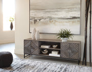 Ashley Furniture Treybrook Accent Cabinet with wooden finish and stylish design, featuring multiple storage compartments.