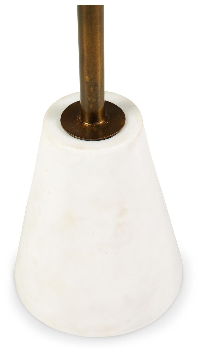 Ashley Furniture Caramont accent table with a wooden base and detailed design, shown in a close-up view.