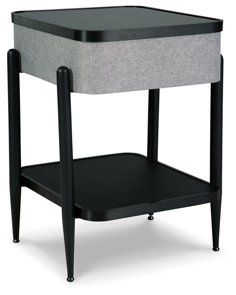 Ashley Furniture Jorvalee accent table with built-in speaker, featuring a sleek wooden surface and modern design.