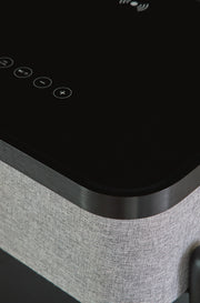 Ashley Furniture Jorvalee accent table with built-in speaker, featuring a sleek wooden surface and modern design.