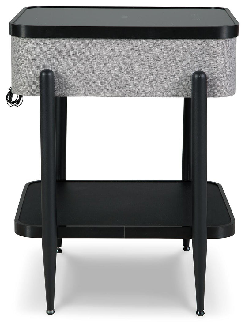 Ashley Furniture Jorvalee accent table with built-in speaker, featuring a sleek wooden surface and modern design.