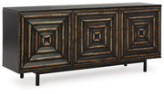 Ashley Furniture Fair Ridge Accent Cabinet with closed doors, wooden finish, and modern design, shown from an angled side view.