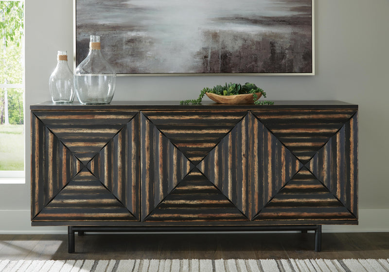 Ashley Furniture Fair Ridge Accent Cabinet with wood finish and decorative handles, showcasing storage with a stylish design.