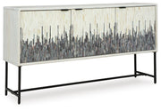 Ashley Furniture Freyton Accent Cabinet with closed doors, wood finish, and modern design, shown from an angled side view.