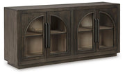 Ashley Furniture Dreley Accent Cabinet with closed doors, wood finish, and modern design, shown from an angle.