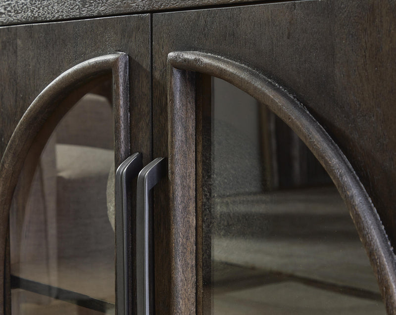 Close-up of the door detail on the Dreley Accent Cabinet by Ashley Furniture, showcasing its elegant wood finish and craftsmanship.